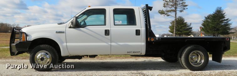 image for item DH1703 2006 Ford F350 Super Duty XL Crew Cab flatbed pickup truck