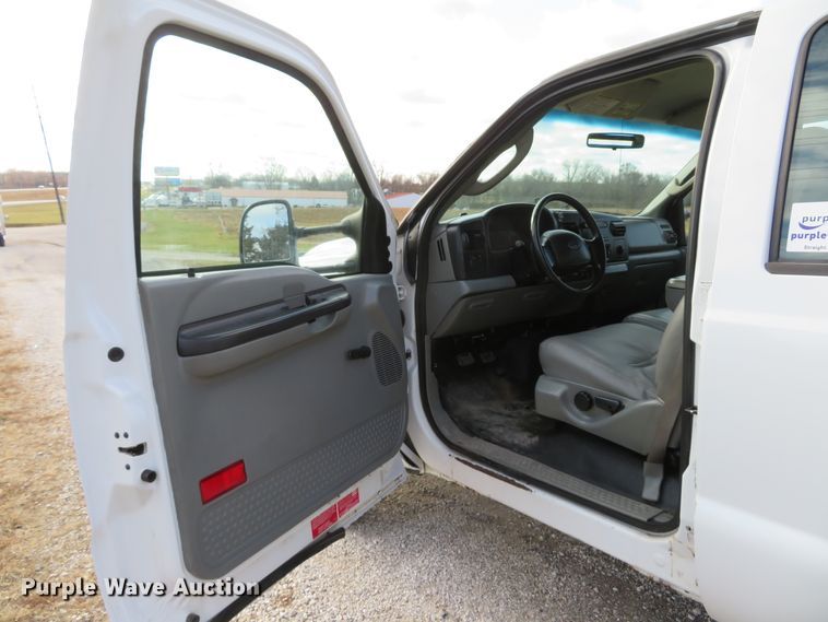 image for item DH1703 2006 Ford F350 Super Duty XL Crew Cab flatbed pickup truck