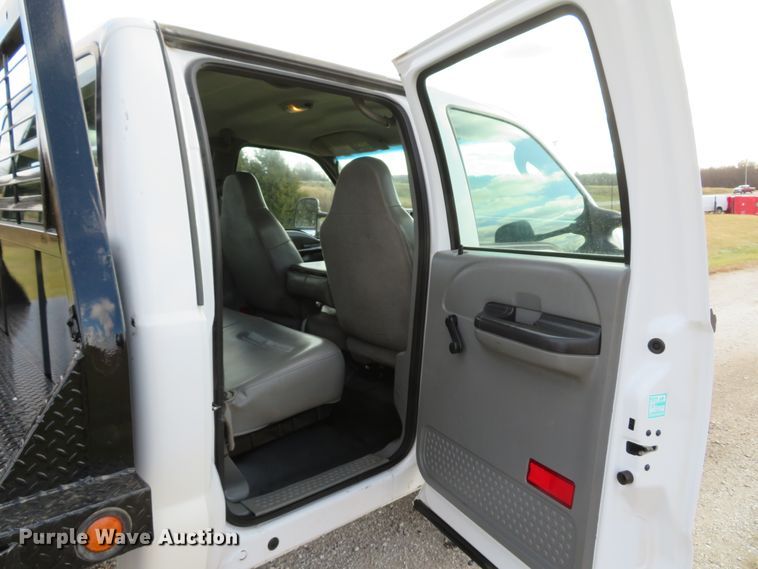 image for item DH1703 2006 Ford F350 Super Duty XL Crew Cab flatbed pickup truck
