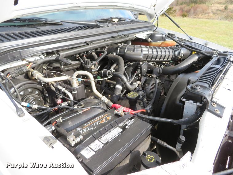 image for item DH1703 2006 Ford F350 Super Duty XL Crew Cab flatbed pickup truck