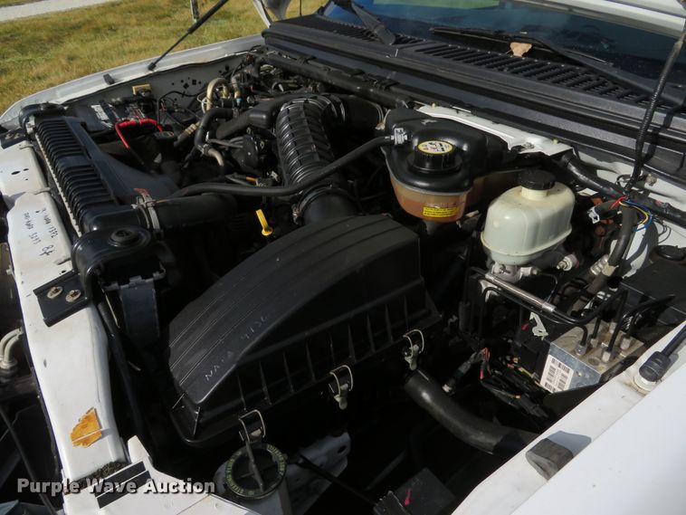 image for item DH1703 2006 Ford F350 Super Duty XL Crew Cab flatbed pickup truck