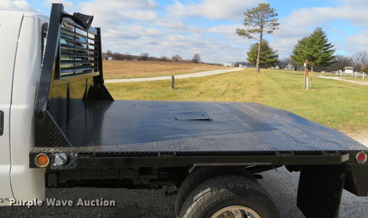 image for item DH1703 2006 Ford F350 Super Duty XL Crew Cab flatbed pickup truck