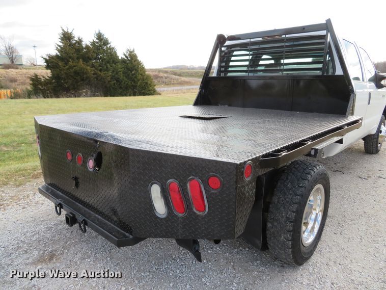 image for item DH1703 2006 Ford F350 Super Duty XL Crew Cab flatbed pickup truck