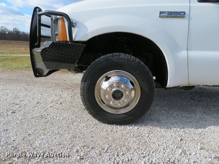 image for item DH1703 2006 Ford F350 Super Duty XL Crew Cab flatbed pickup truck