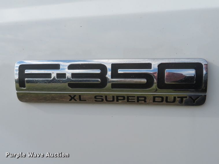 image for item DH1703 2006 Ford F350 Super Duty XL Crew Cab flatbed pickup truck