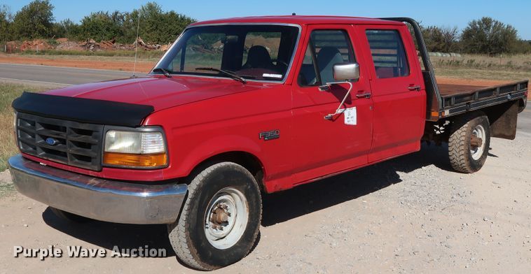 image for item GD9777 1996 Ford F350 XL Crew Cab flatbed pickup truck