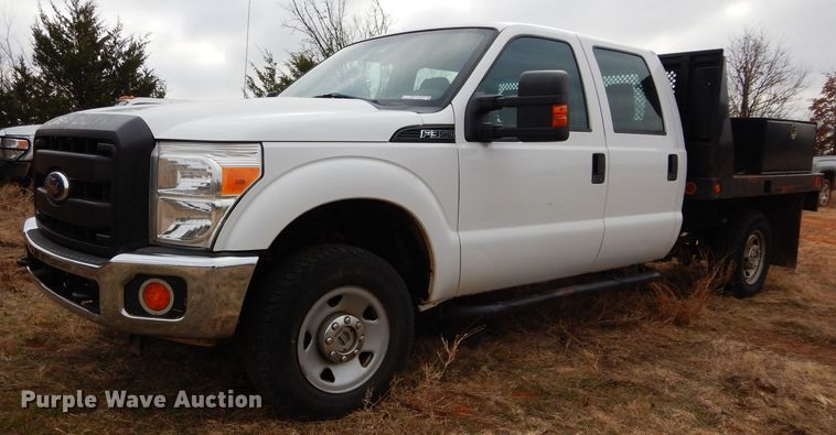 image for item GF9919 2012 Ford F350 Super Duty Crew Cab flatbed pickup truck