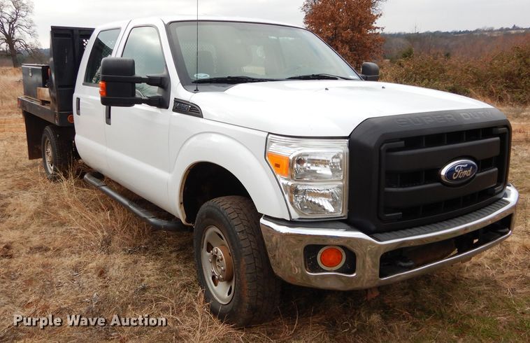 image for item GF9919 2012 Ford F350 Super Duty Crew Cab flatbed pickup truck