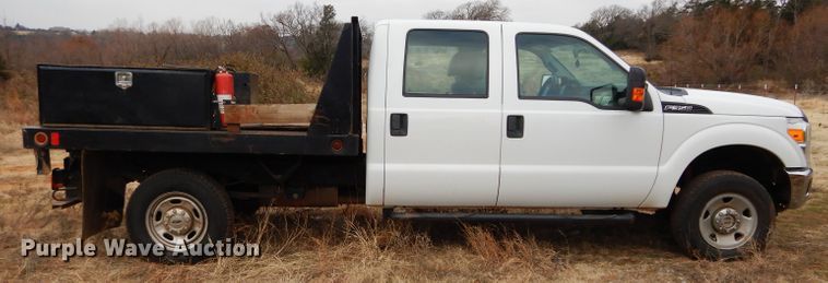 image for item GF9919 2012 Ford F350 Super Duty Crew Cab flatbed pickup truck