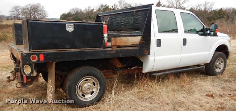 image for item GF9919 2012 Ford F350 Super Duty Crew Cab flatbed pickup truck