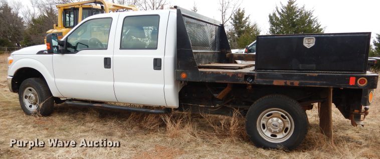 image for item GF9919 2012 Ford F350 Super Duty Crew Cab flatbed pickup truck