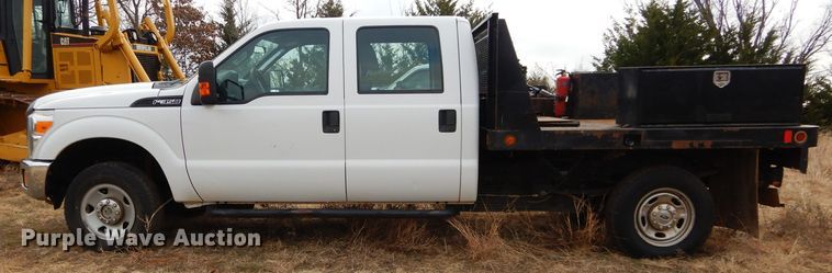 image for item GF9919 2012 Ford F350 Super Duty Crew Cab flatbed pickup truck