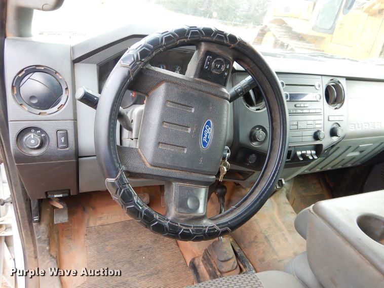 image for item GF9919 2012 Ford F350 Super Duty Crew Cab flatbed pickup truck