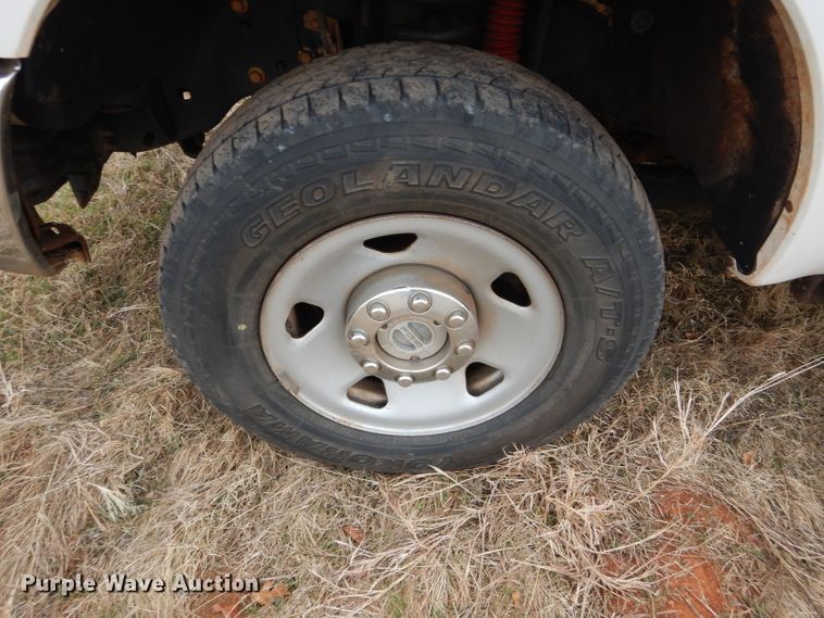 image for item GF9919 2012 Ford F350 Super Duty Crew Cab flatbed pickup truck