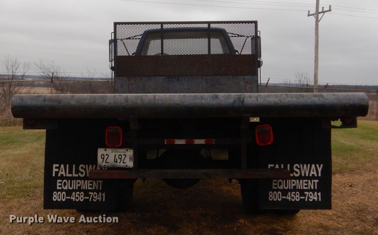 image for item DH5043 2002 GMC C6500 flat dump bed truck