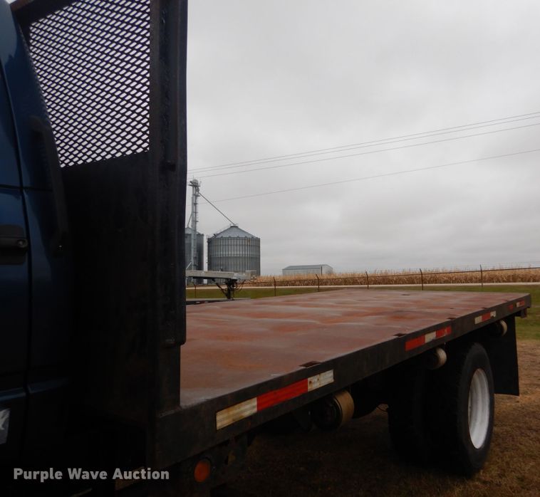 image for item DH5043 2002 GMC C6500 flat dump bed truck