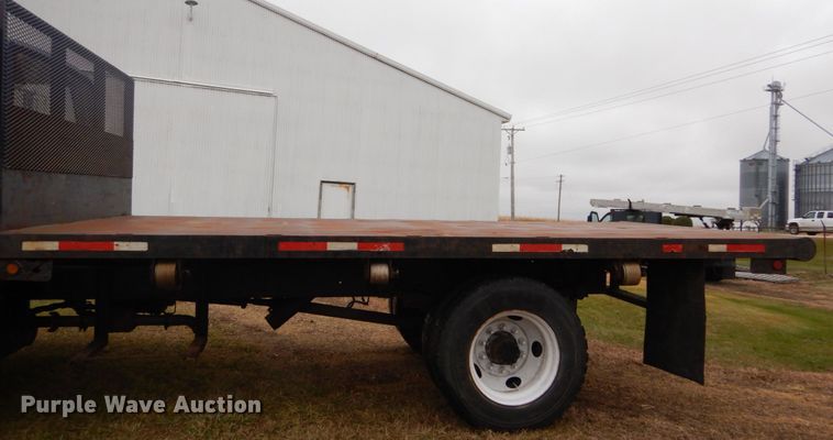 image for item DH5043 2002 GMC C6500 flat dump bed truck