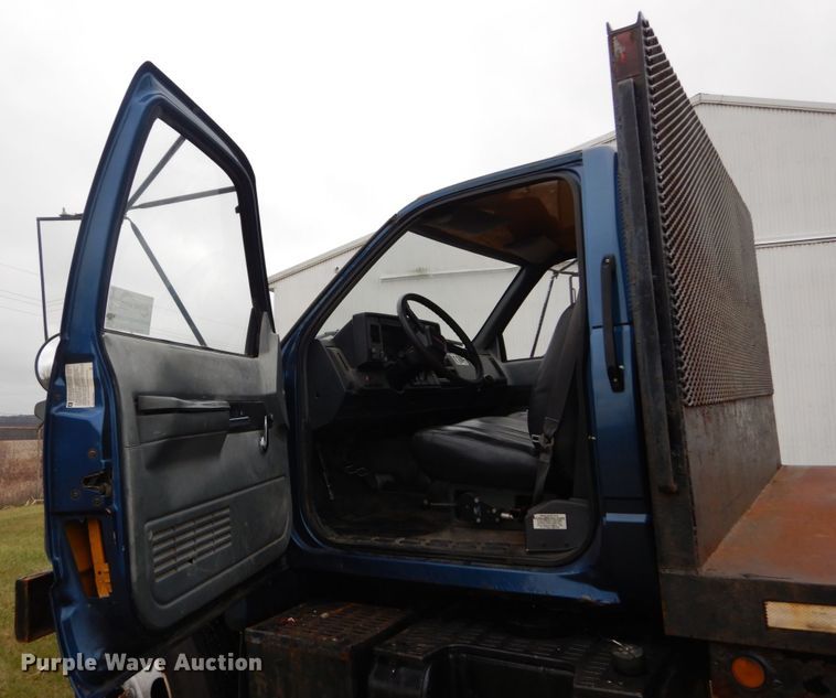 image for item DH5043 2002 GMC C6500 flat dump bed truck