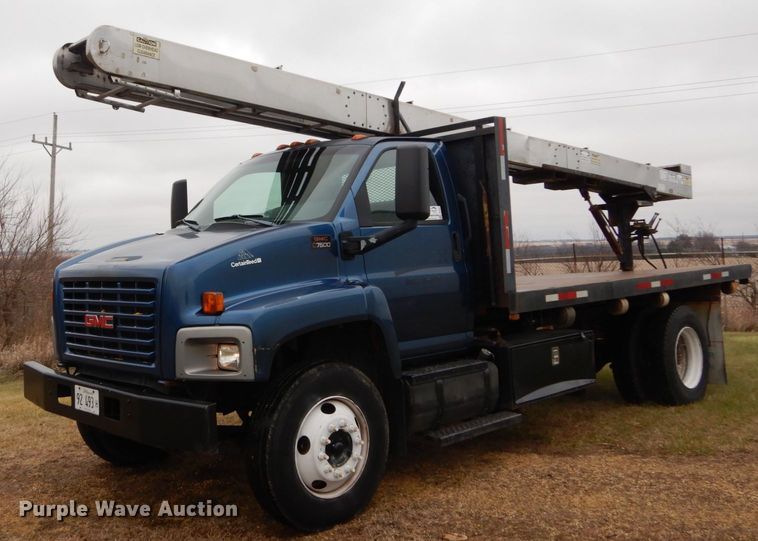 image for item DH5044 2003 GMC C7500 flat dump bed truck with conveyor