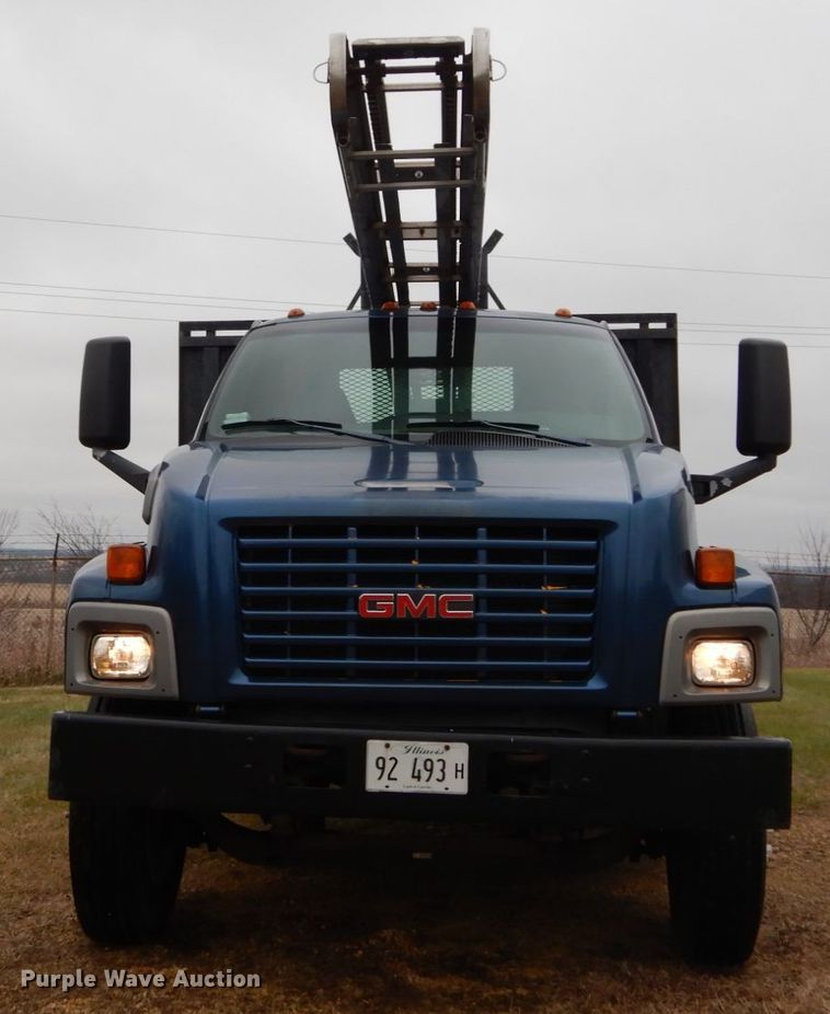 image for item DH5044 2003 GMC C7500 flat dump bed truck with conveyor