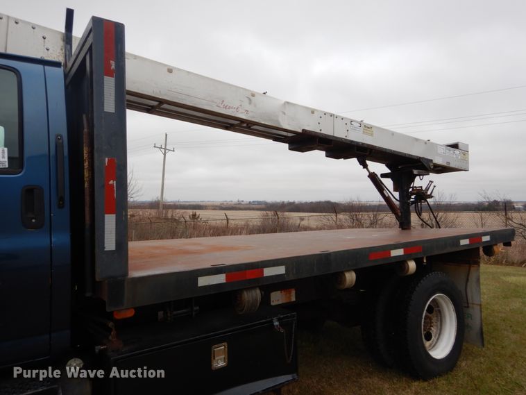 image for item DH5044 2003 GMC C7500 flat dump bed truck with conveyor