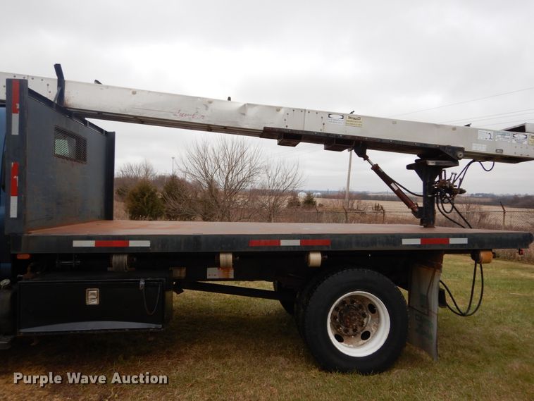 image for item DH5044 2003 GMC C7500 flat dump bed truck with conveyor