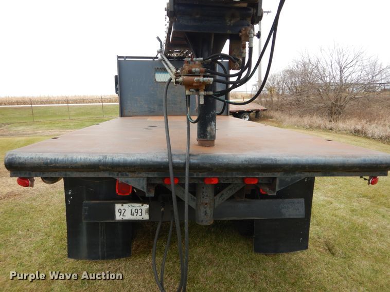 image for item DH5044 2003 GMC C7500 flat dump bed truck with conveyor