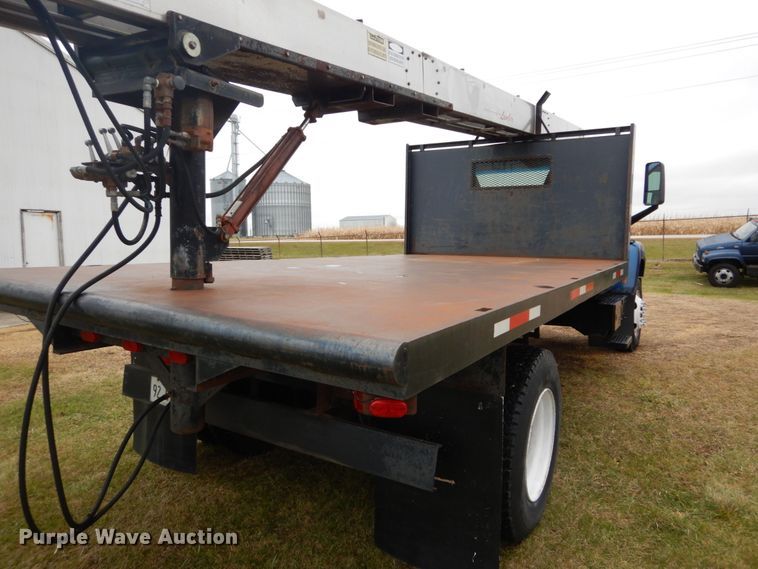 image for item DH5044 2003 GMC C7500 flat dump bed truck with conveyor