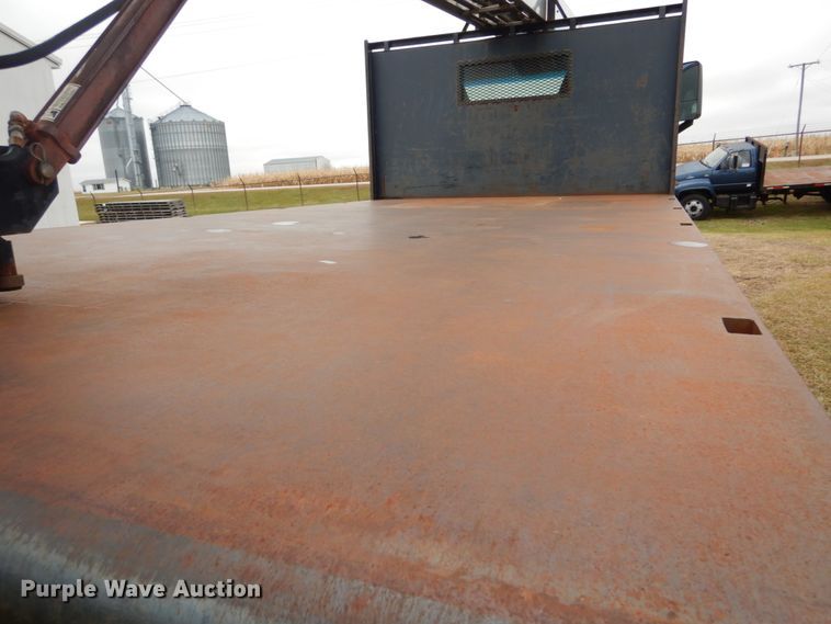 image for item DH5044 2003 GMC C7500 flat dump bed truck with conveyor