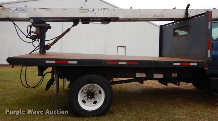 image for item DH5044 2003 GMC C7500 flat dump bed truck with conveyor