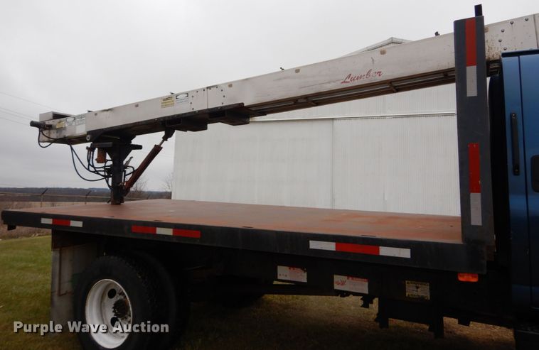 image for item DH5044 2003 GMC C7500 flat dump bed truck with conveyor