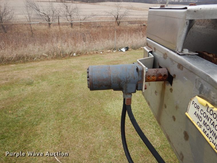 image for item DH5044 2003 GMC C7500 flat dump bed truck with conveyor