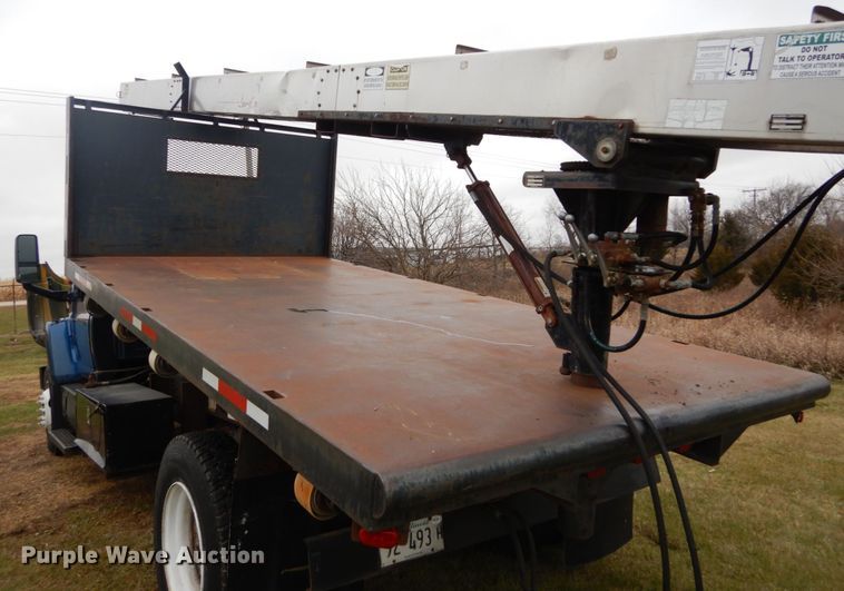 image for item DH5044 2003 GMC C7500 flat dump bed truck with conveyor