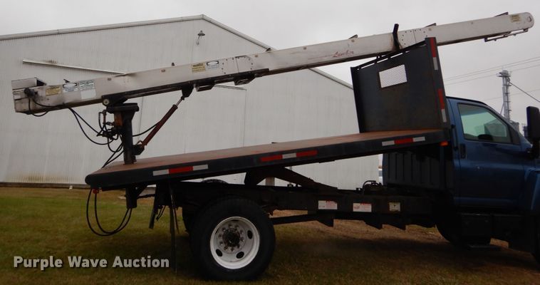 image for item DH5044 2003 GMC C7500 flat dump bed truck with conveyor