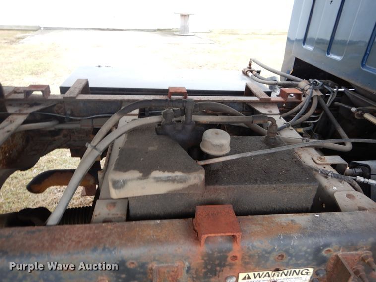 image for item DH5044 2003 GMC C7500 flat dump bed truck with conveyor