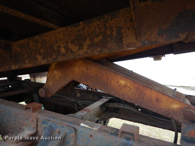 image for item DH5044 2003 GMC C7500 flat dump bed truck with conveyor