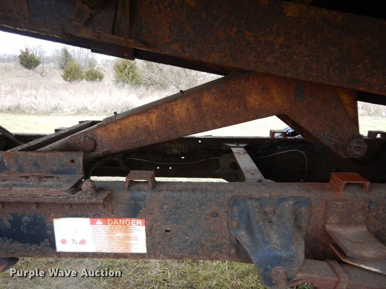 image for item DH5044 2003 GMC C7500 flat dump bed truck with conveyor