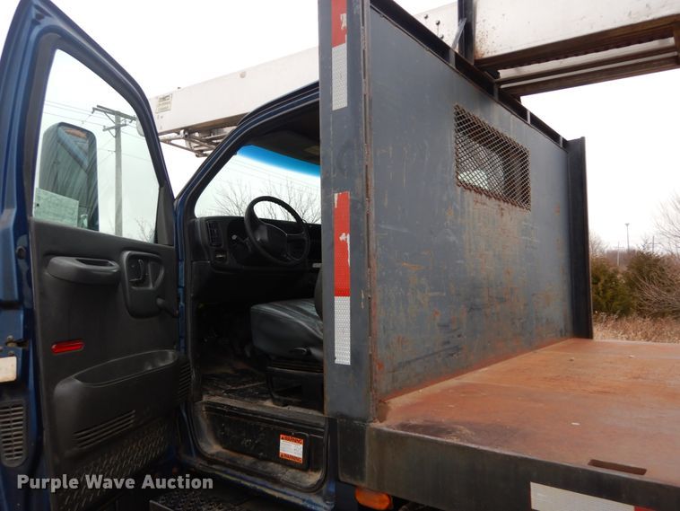 image for item DH5044 2003 GMC C7500 flat dump bed truck with conveyor