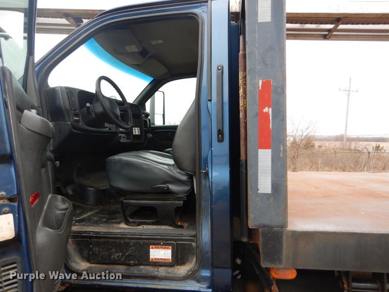 image for item DH5044 2003 GMC C7500 flat dump bed truck with conveyor