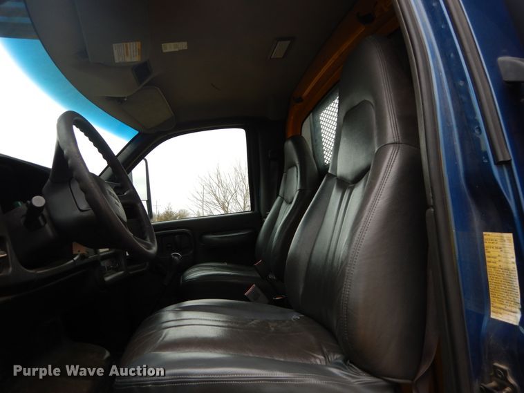 image for item DH5044 2003 GMC C7500 flat dump bed truck with conveyor