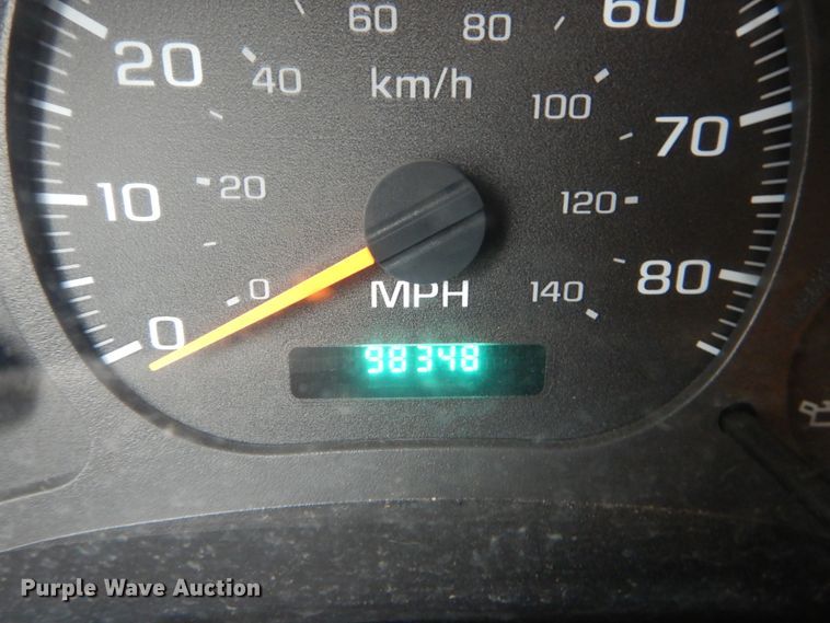 image for item DH5044 2003 GMC C7500 flat dump bed truck with conveyor