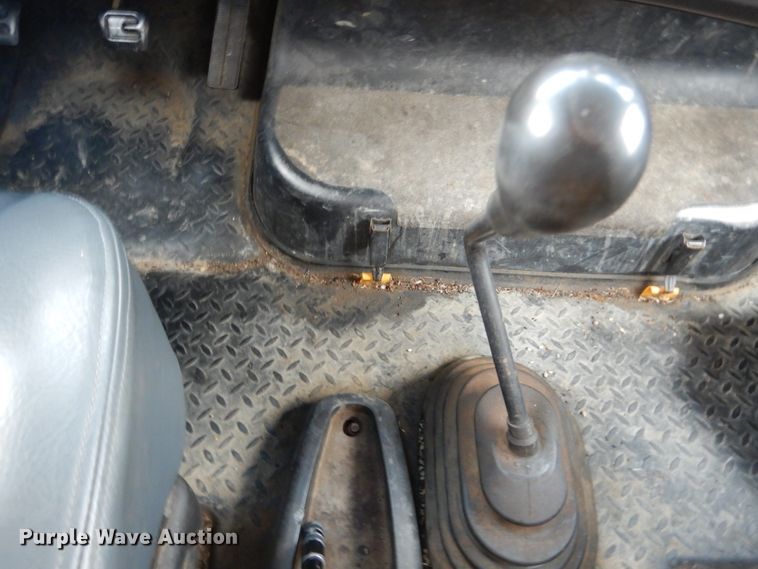 image for item DH5044 2003 GMC C7500 flat dump bed truck with conveyor