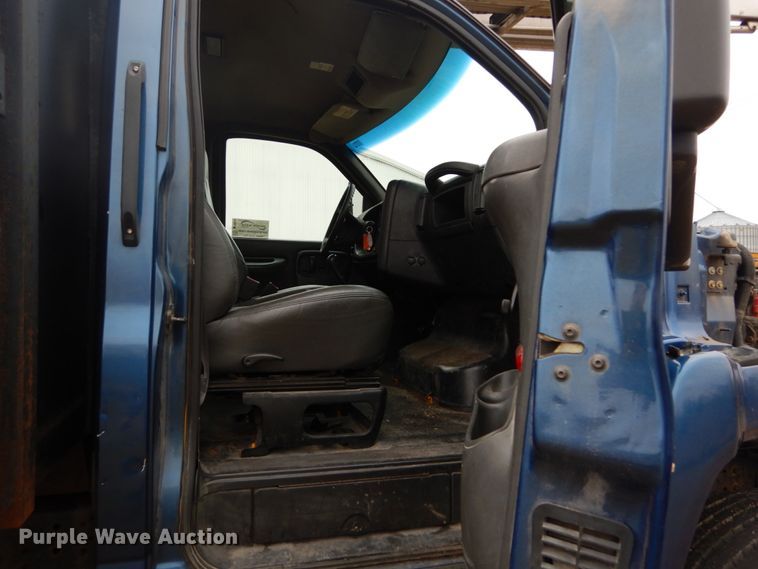 image for item DH5044 2003 GMC C7500 flat dump bed truck with conveyor