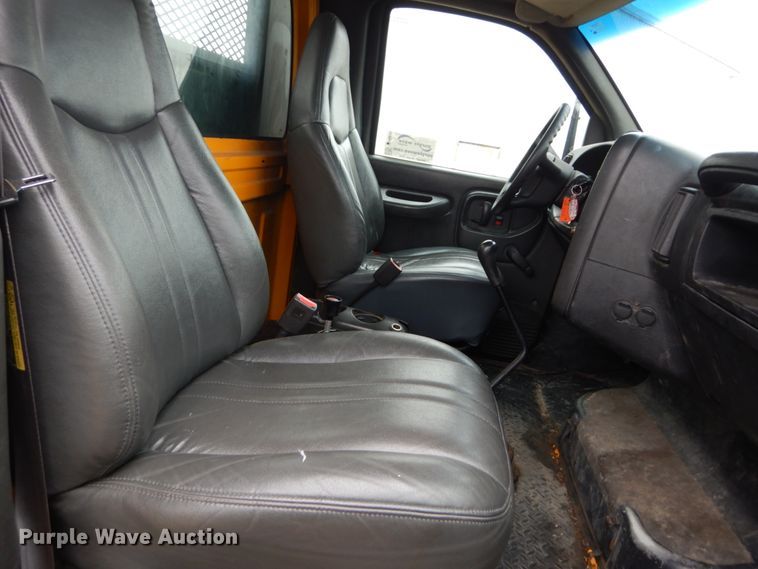 image for item DH5044 2003 GMC C7500 flat dump bed truck with conveyor