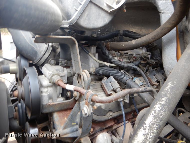 image for item DH5044 2003 GMC C7500 flat dump bed truck with conveyor