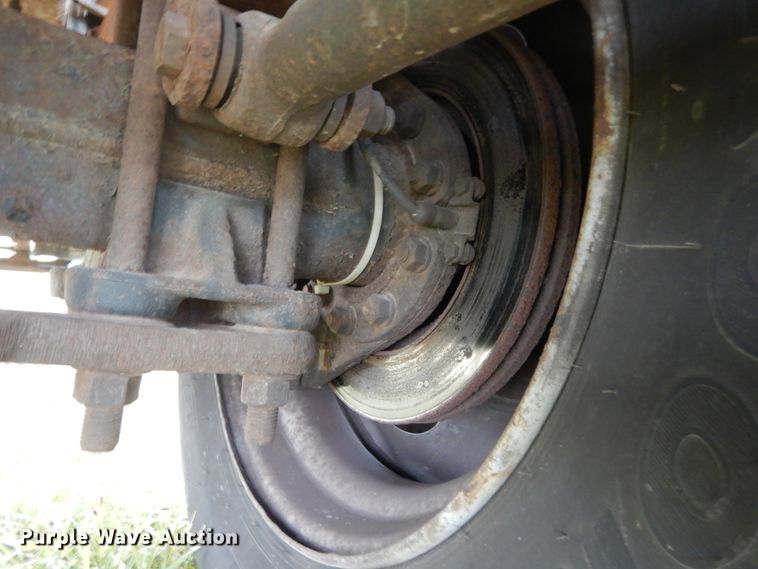 image for item DH5044 2003 GMC C7500 flat dump bed truck with conveyor