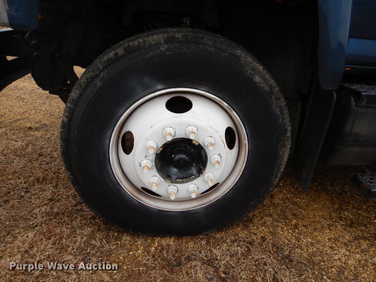 image for item DH5044 2003 GMC C7500 flat dump bed truck with conveyor