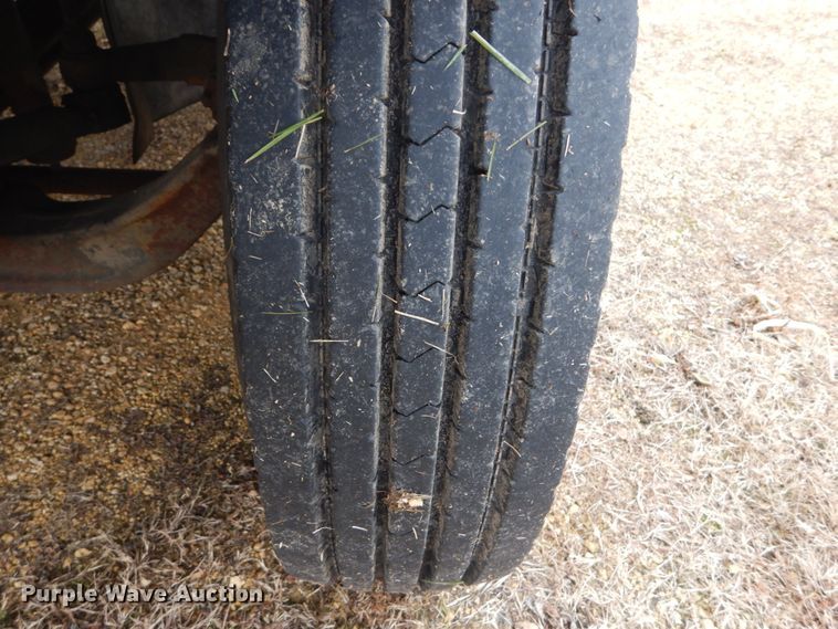 image for item DH5044 2003 GMC C7500 flat dump bed truck with conveyor