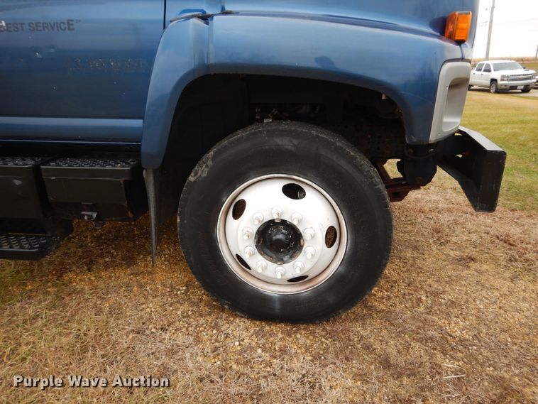 image for item DH5044 2003 GMC C7500 flat dump bed truck with conveyor