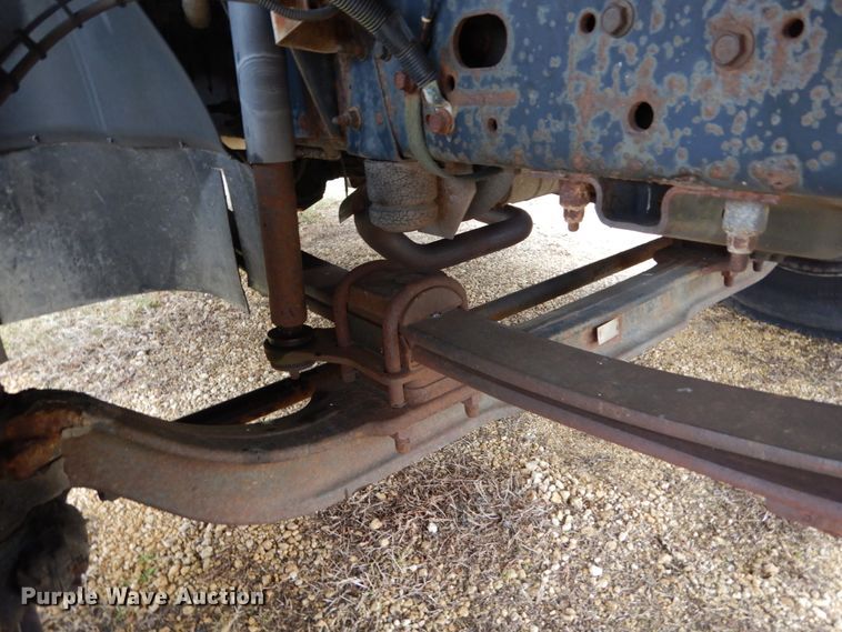 image for item DH5044 2003 GMC C7500 flat dump bed truck with conveyor